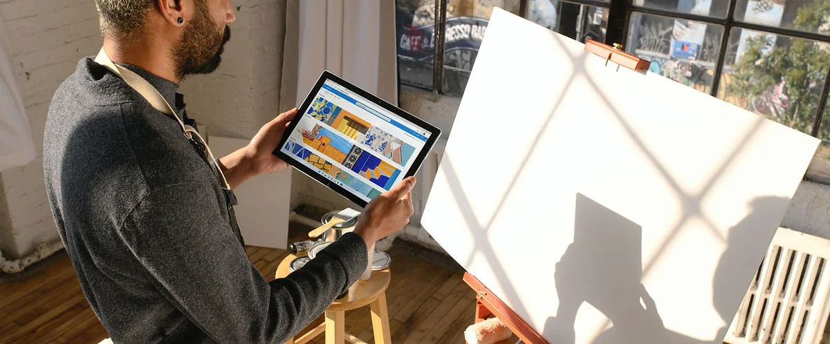 Painting at an easel, illustrating creativity in therapy