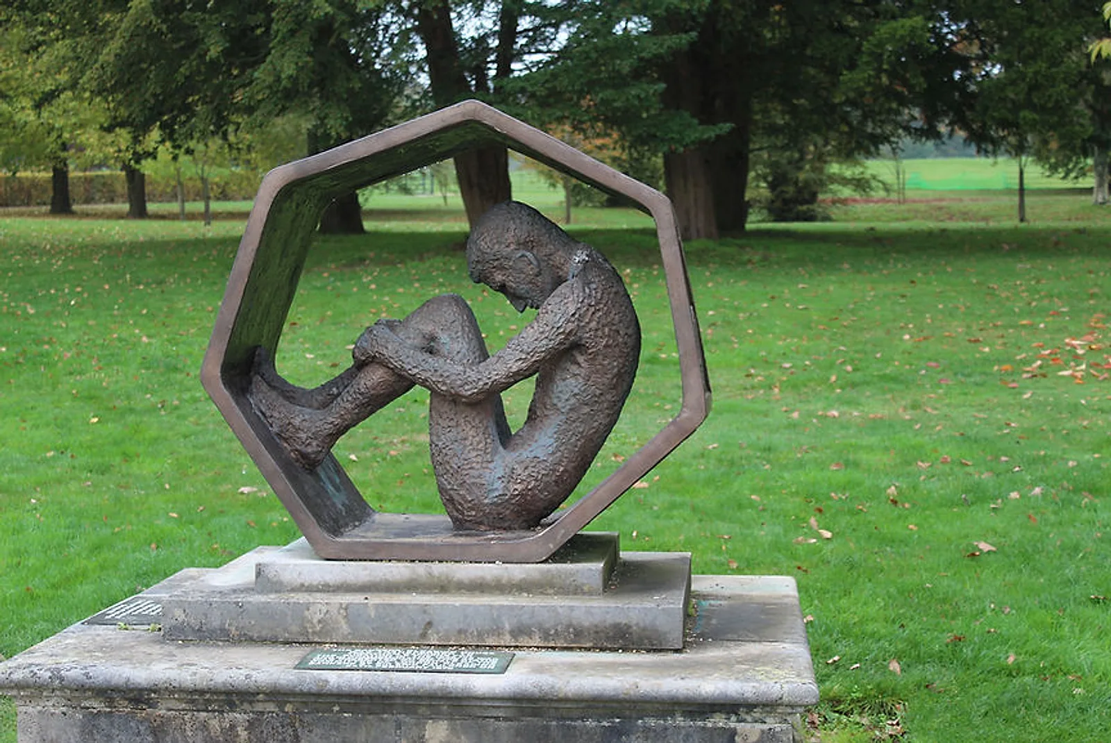 Bronze sculpture of a curled figure inside a hexagonal frame at Trentham Gardens, photograph by Dawn O’Donoghue New Day Therapies